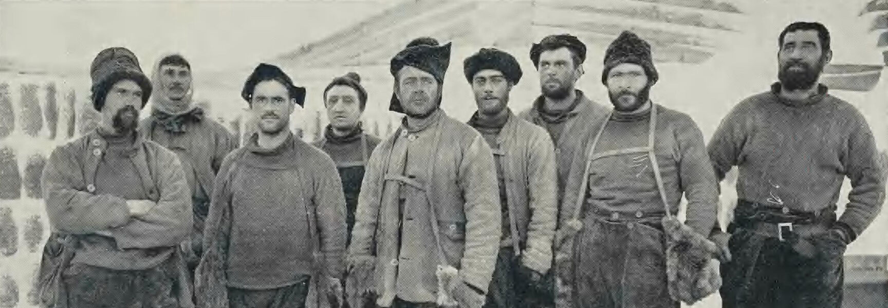 A group portrait of Captain Scott and his team wearing heavy cold-weather gear during their expedition to the South Pole.