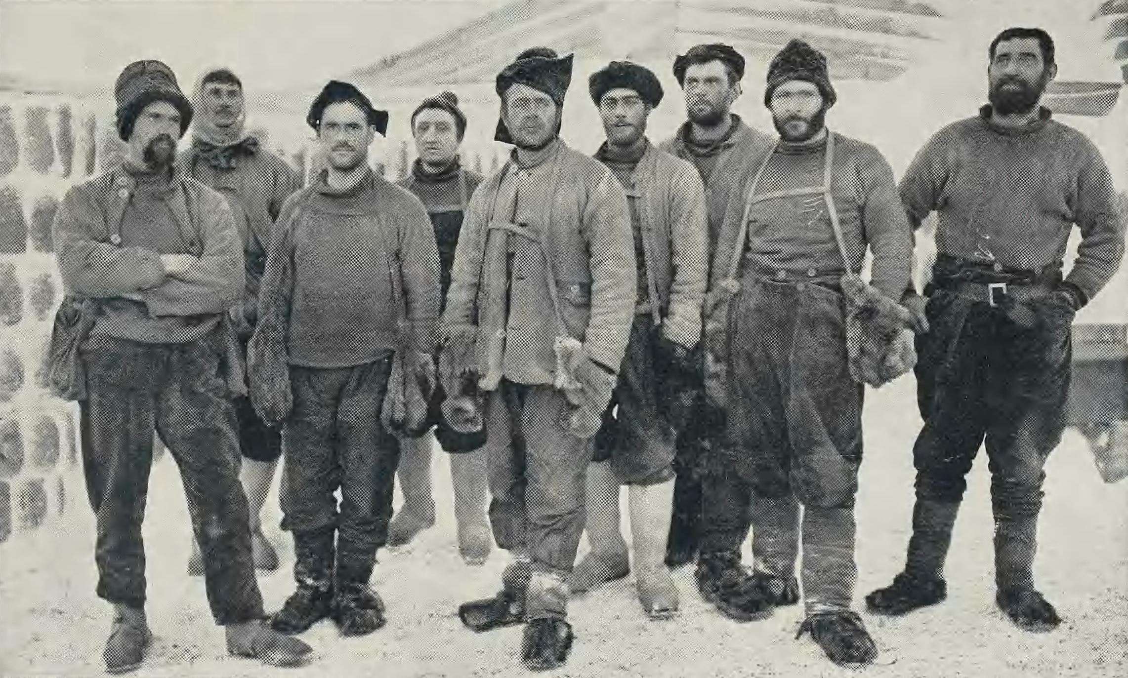 A group portrait of Captain Scott and his team wearing heavy cold-weather gear during their expedition to the South Pole.