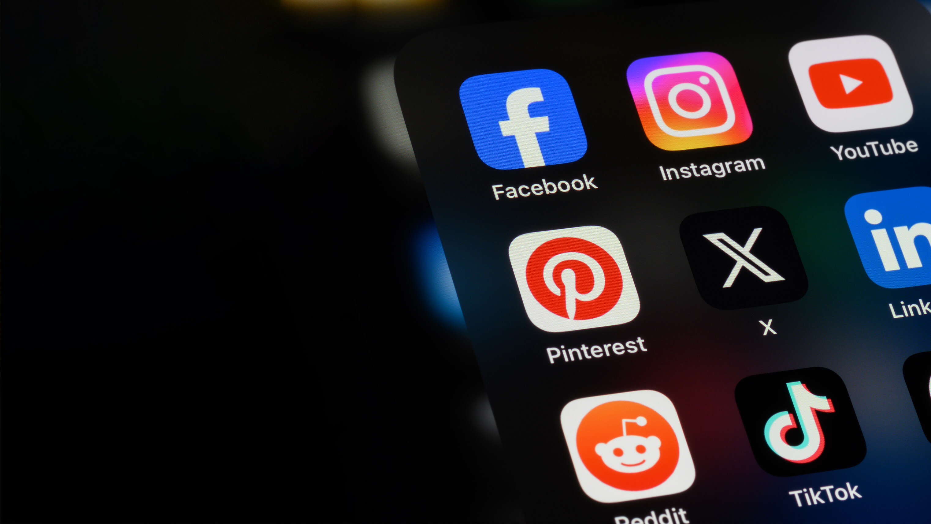 Smartphone with social media icons.