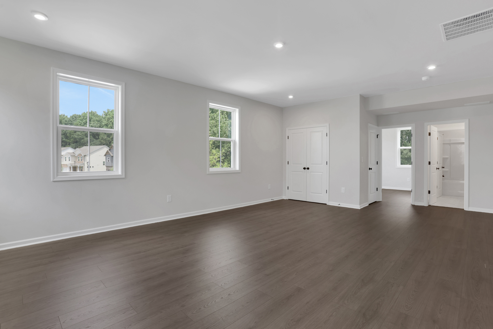 loft with hard surface flooring and windows