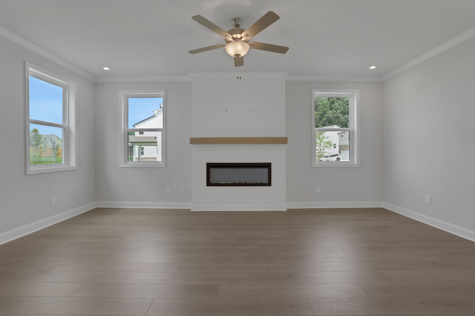 great room with electric fireplace and hard surface flooring
