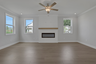 great room with electric fireplace and hard surface flooring