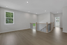 loft with hard surface flooring and windows