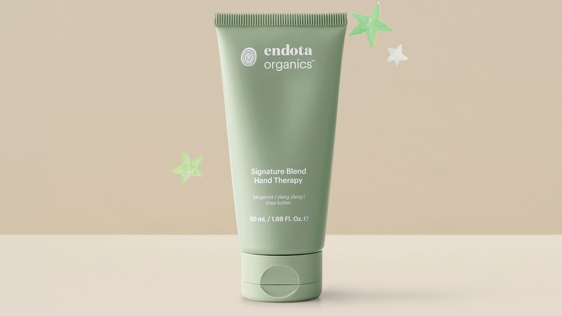 free signature blend hand therapy 50ml, with any $100+ product purchase at endota, image of a 50ml hand cream with stars