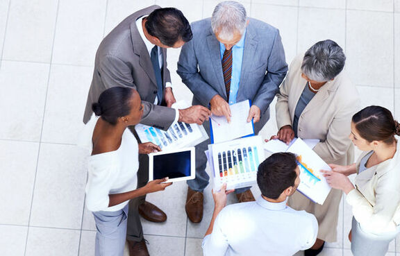 Top down view of a group of business people talking in a circle