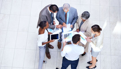 Top down view of a group of business people talking in a circle