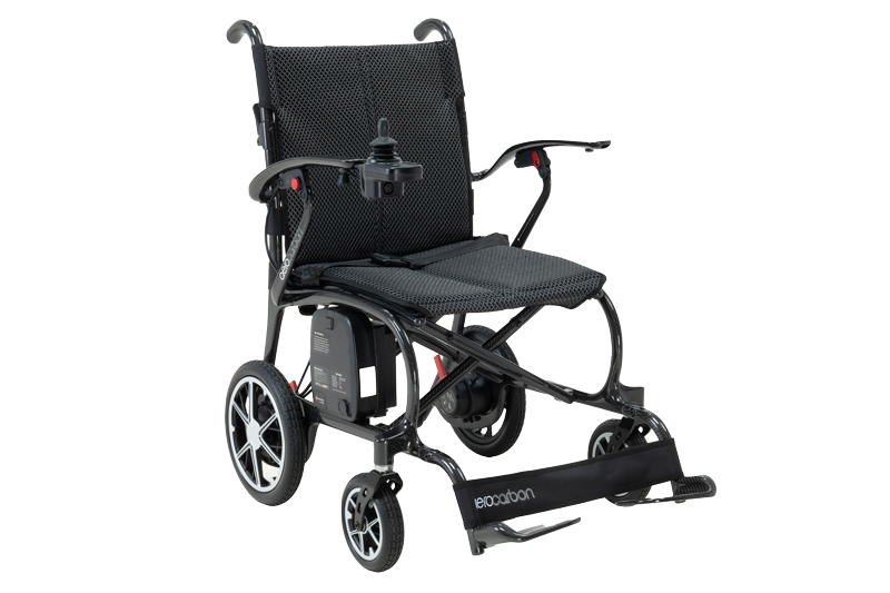 A lightweight, powered wheelchair with a black mesh seat and backrest, slim frame, and four wheels. It features a joystick control on one armrest, foldable design, and carbon-style detailing for a modern look.
