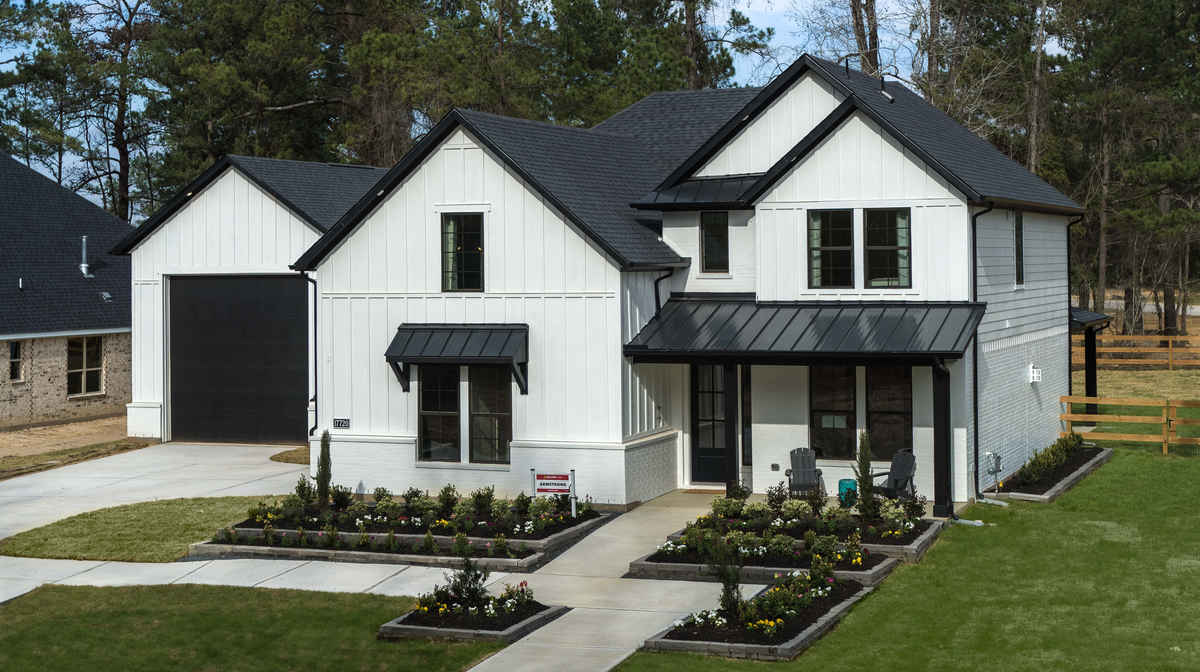 home exterior with lush landscaping 