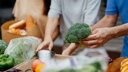Volunteers packing up produce at food bank