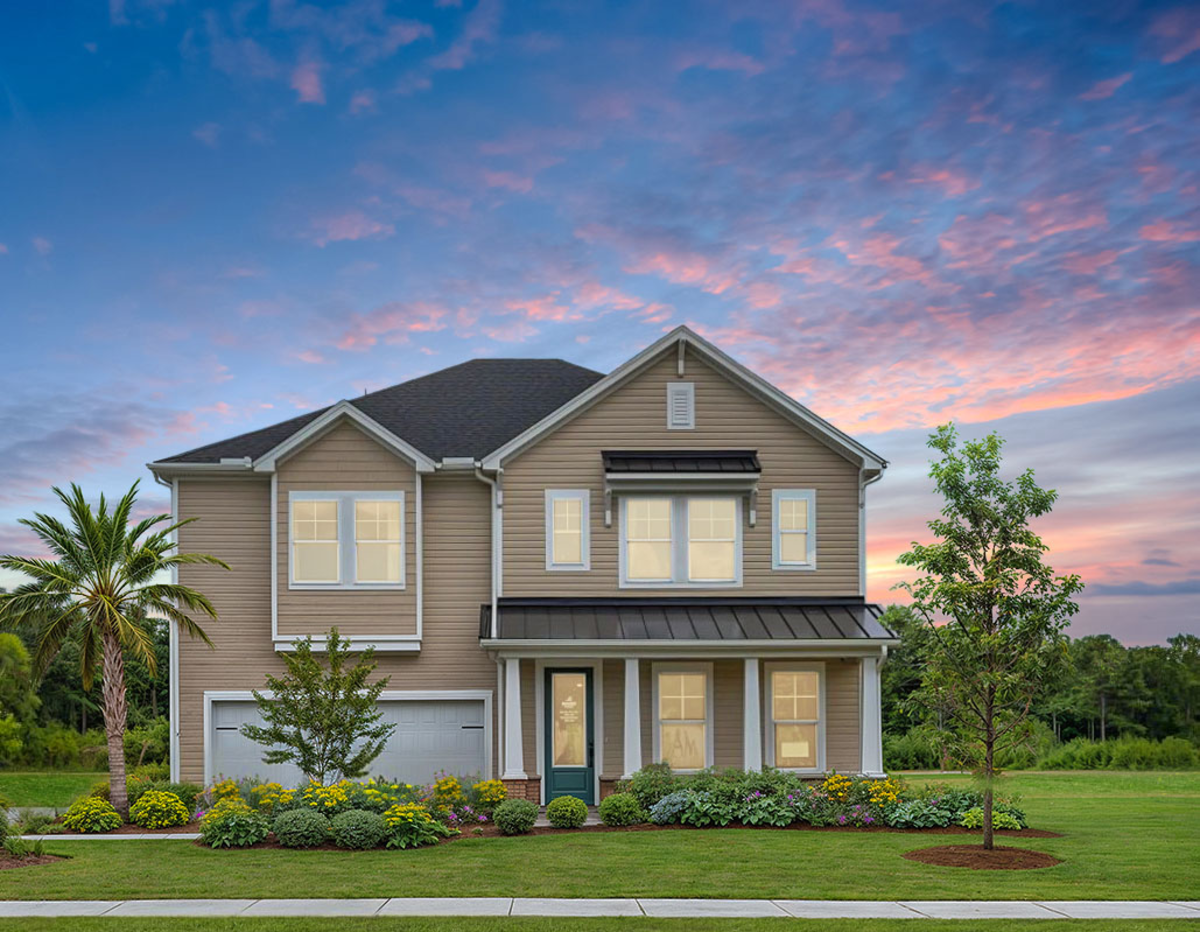 two-story home with metal roof accents