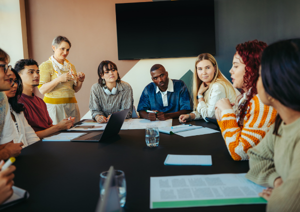 group of people sitting around a table