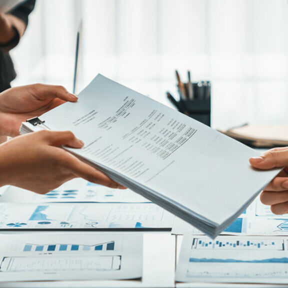 Professional team analyzing financial documents