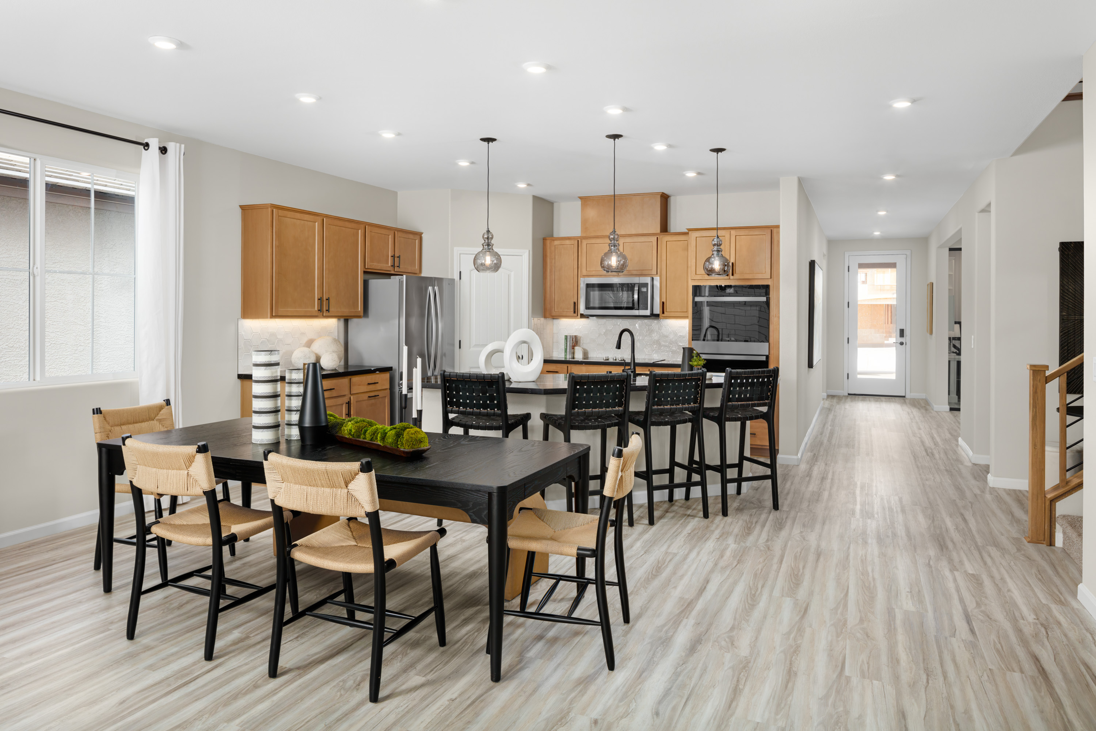 kitchen and dining room with laminate flooring 