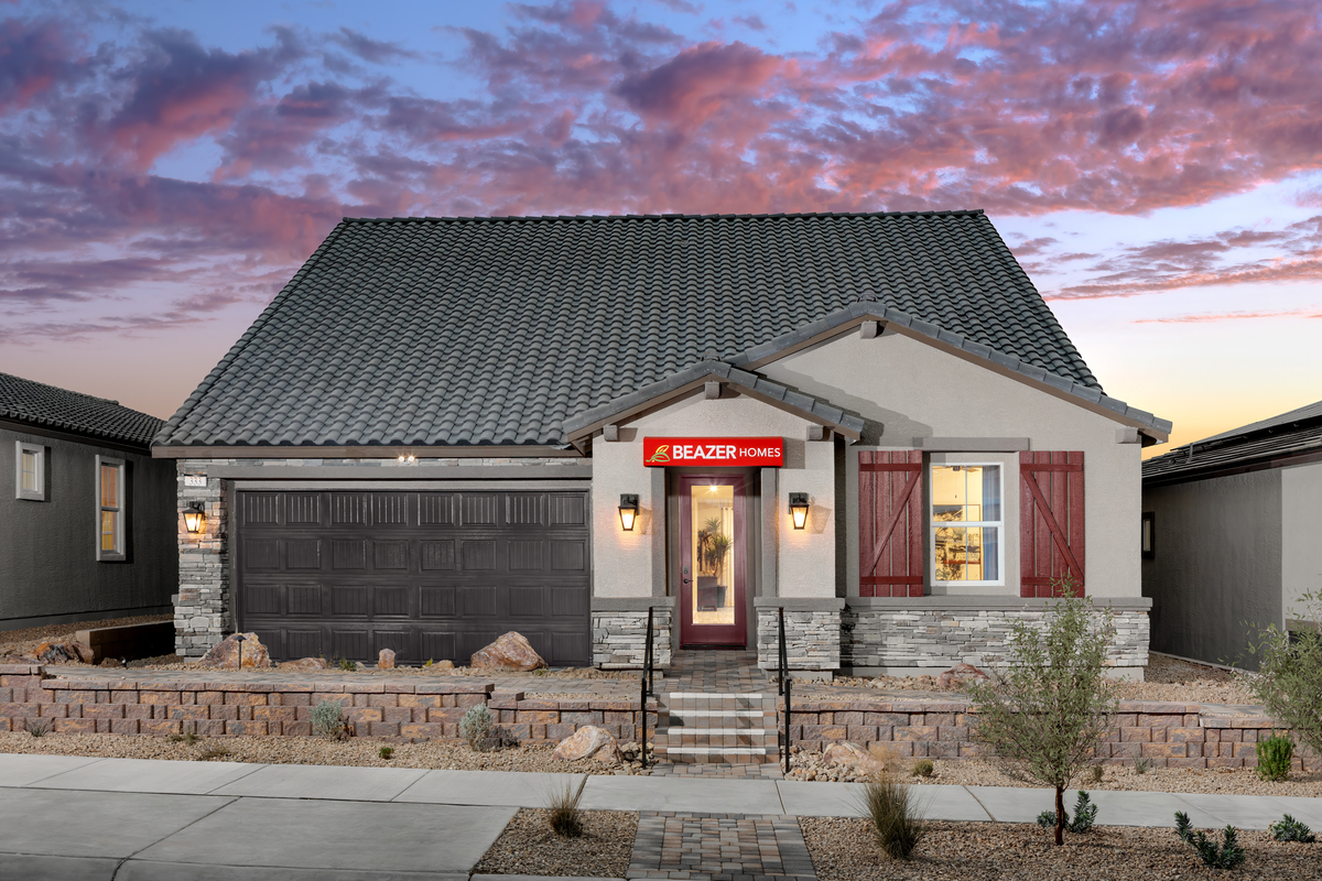one-story home with desert landscaping and pavers