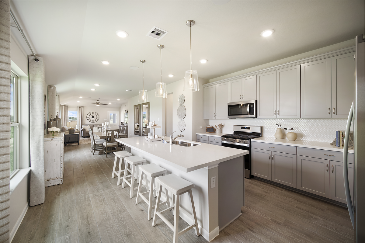 kitchen with large island and white cabinets 