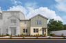 exterior of two-story townhome with large windows and desert landscaping