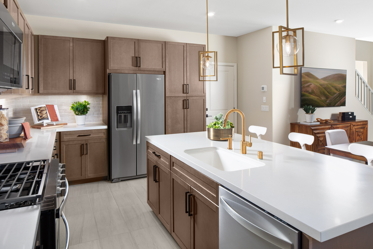 kitchen with large island and brown cabinetry