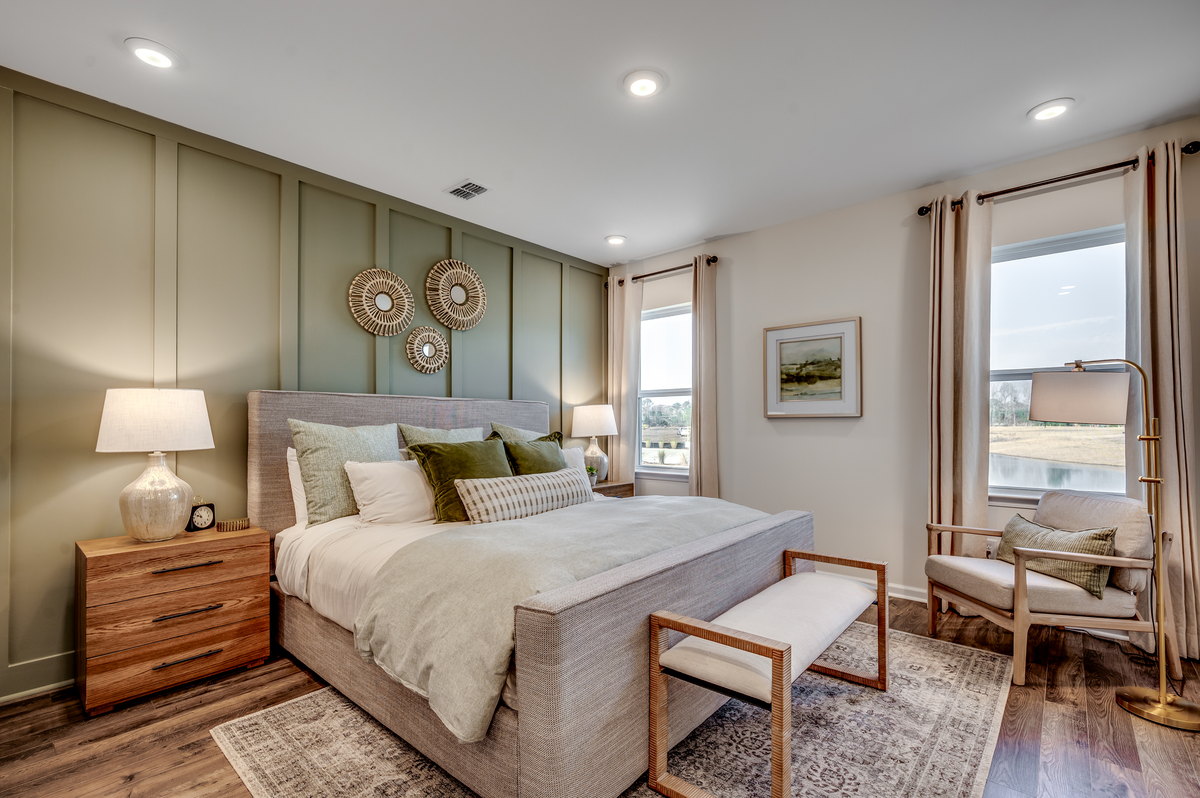 windows for natural light and hardwood throughout