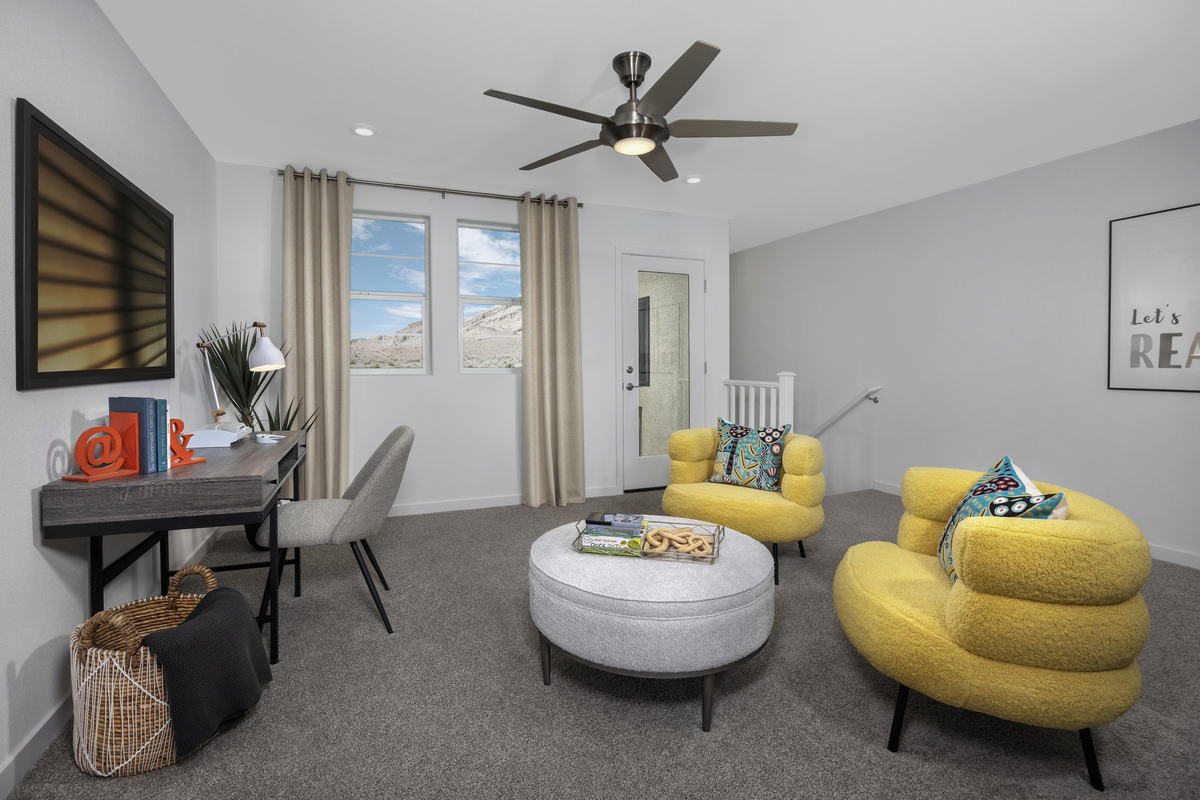 loft with two yellow chairs and table