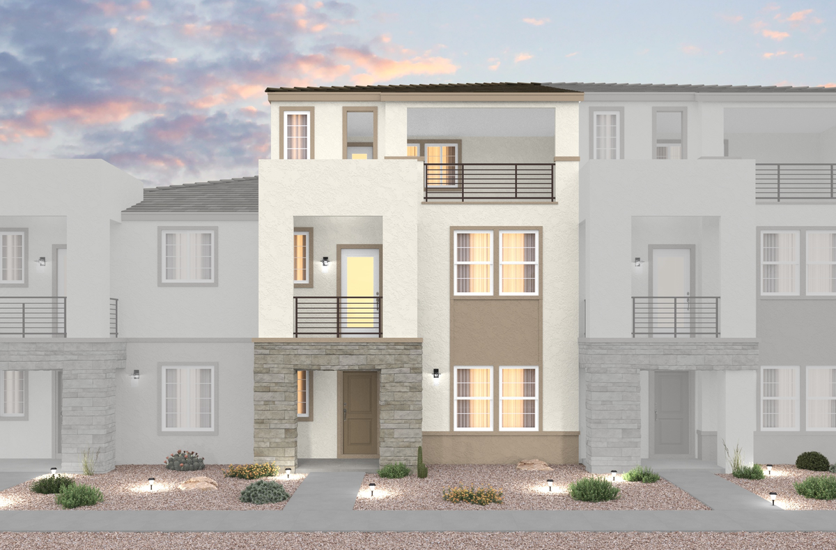 desert landscaping and townhome with two balconies