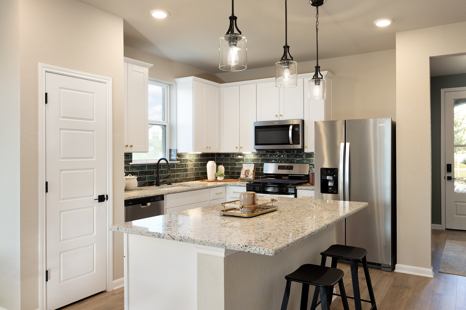 kitchen with granite countertops & white cabinets