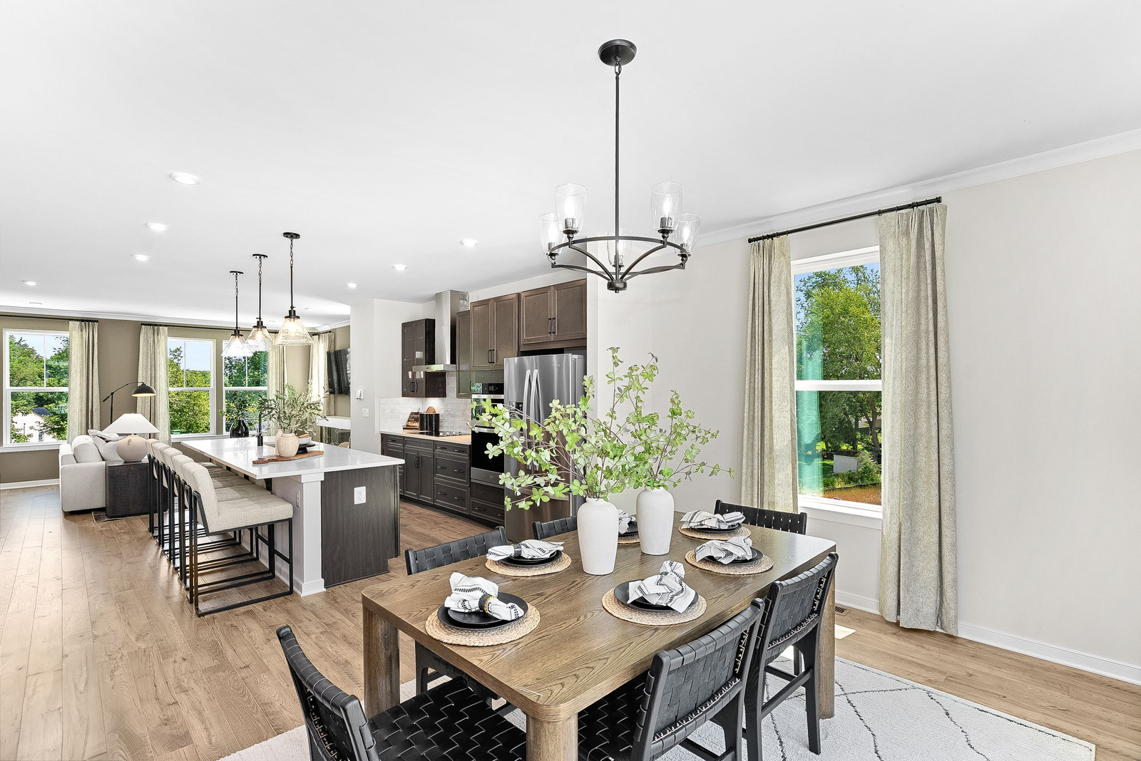 dining table with 5 chairs and view of kitchen