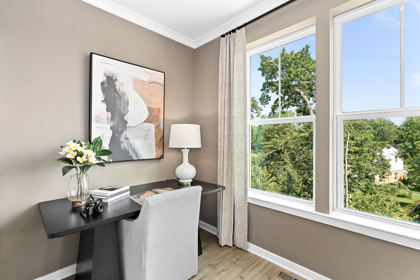 desk with white chair and windows