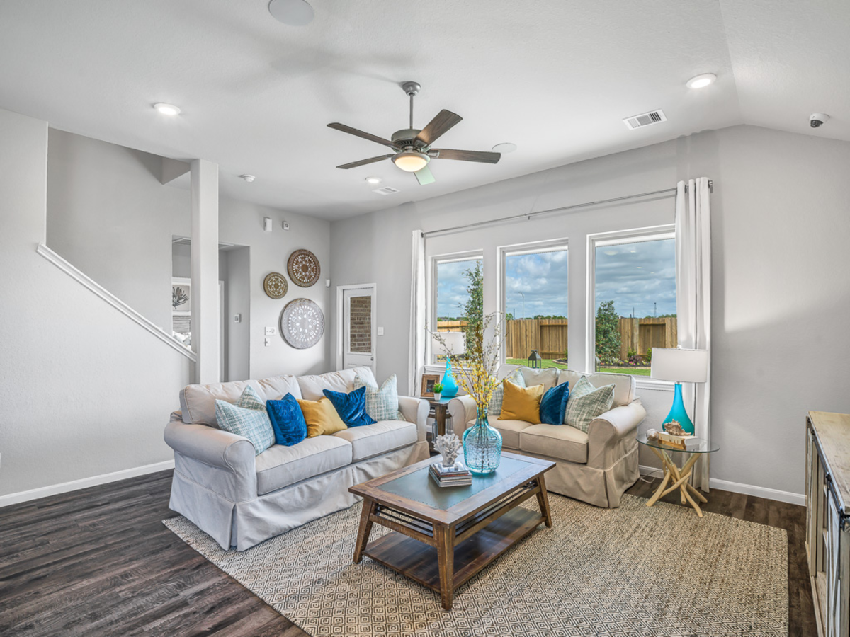 great room with couch and floor rug