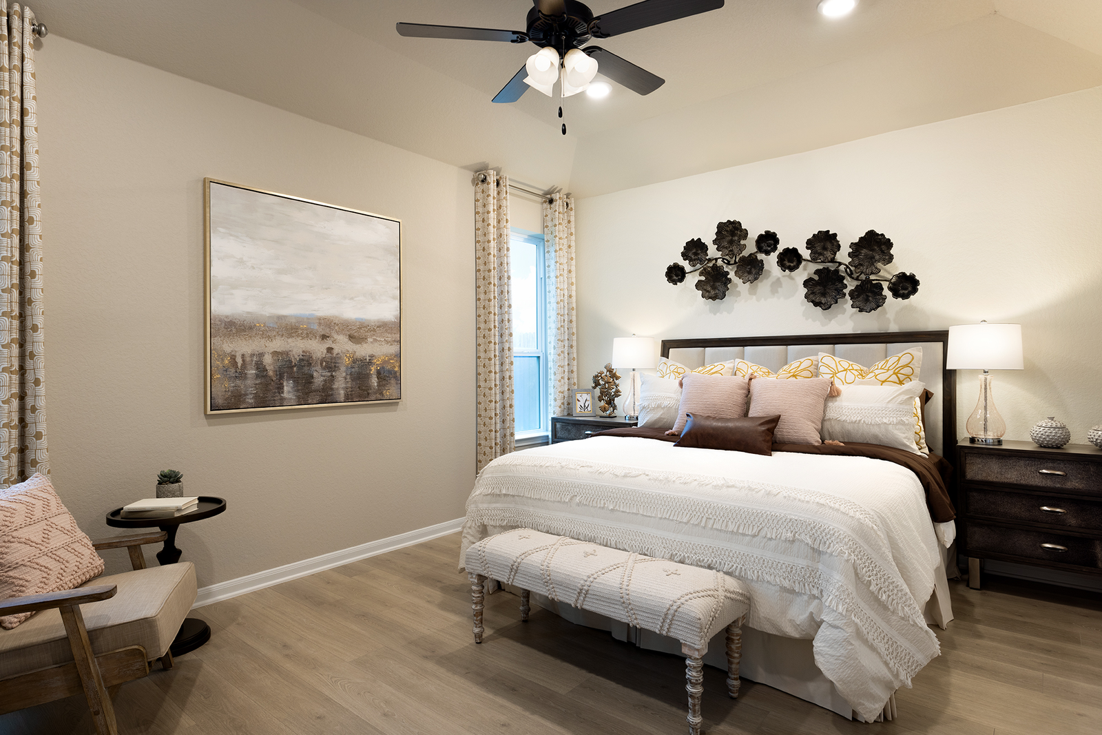 bedroom with brown flooring & picture on the wall