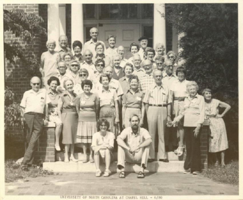 Road Scholars stand on the steps of a building at the University of North Carolina at Chapel Hill in a black and white photo