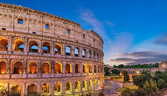 A view of the Colosseum lit up at dusk