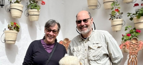 Karen and her husband with an alpaca in Peru