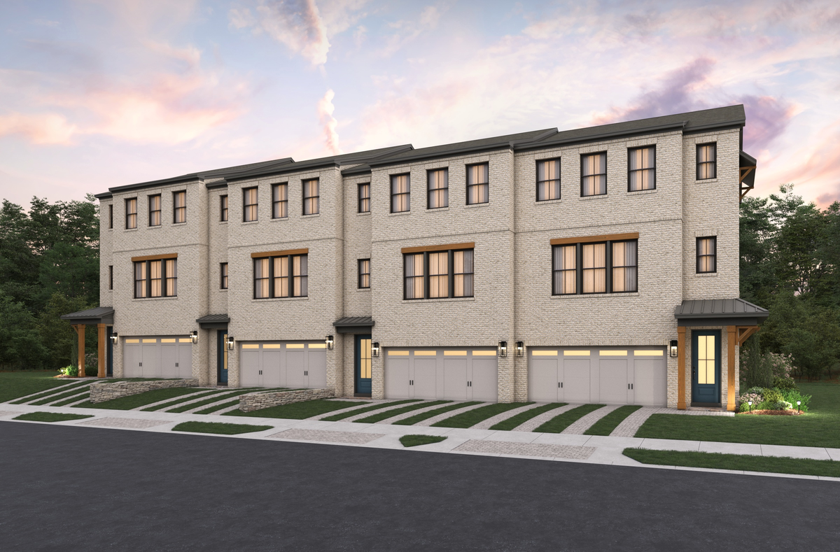 front of front-load townhome building with brick
