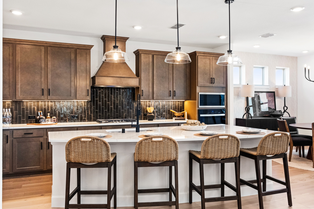 open kitchen with large island and wood floors