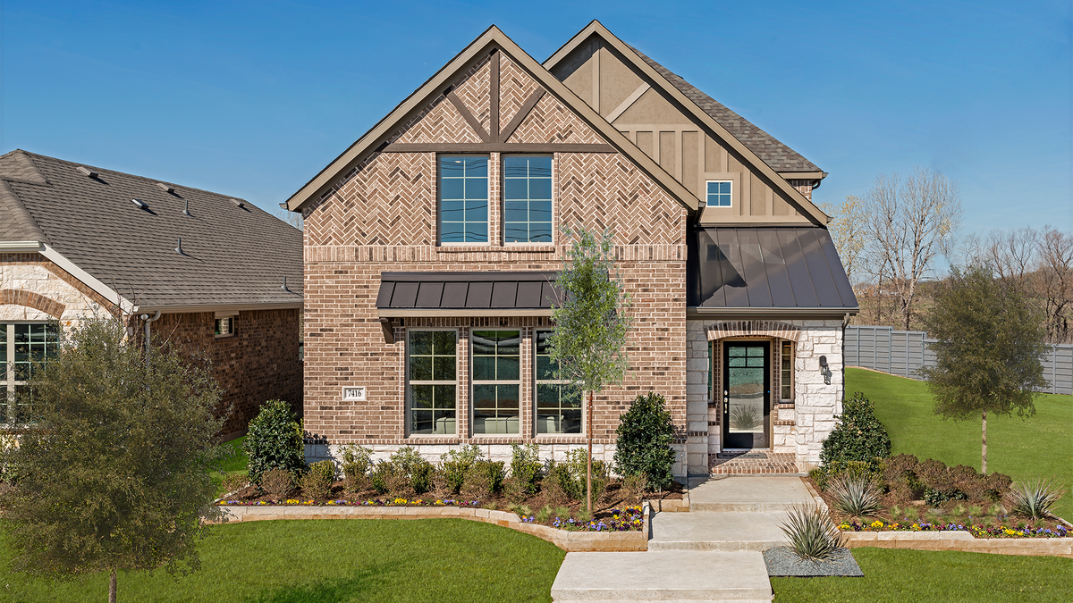 two-story home with brick and stone exterior