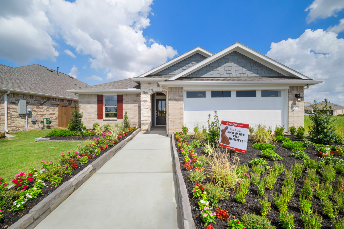 home exterior with landscaping and garage