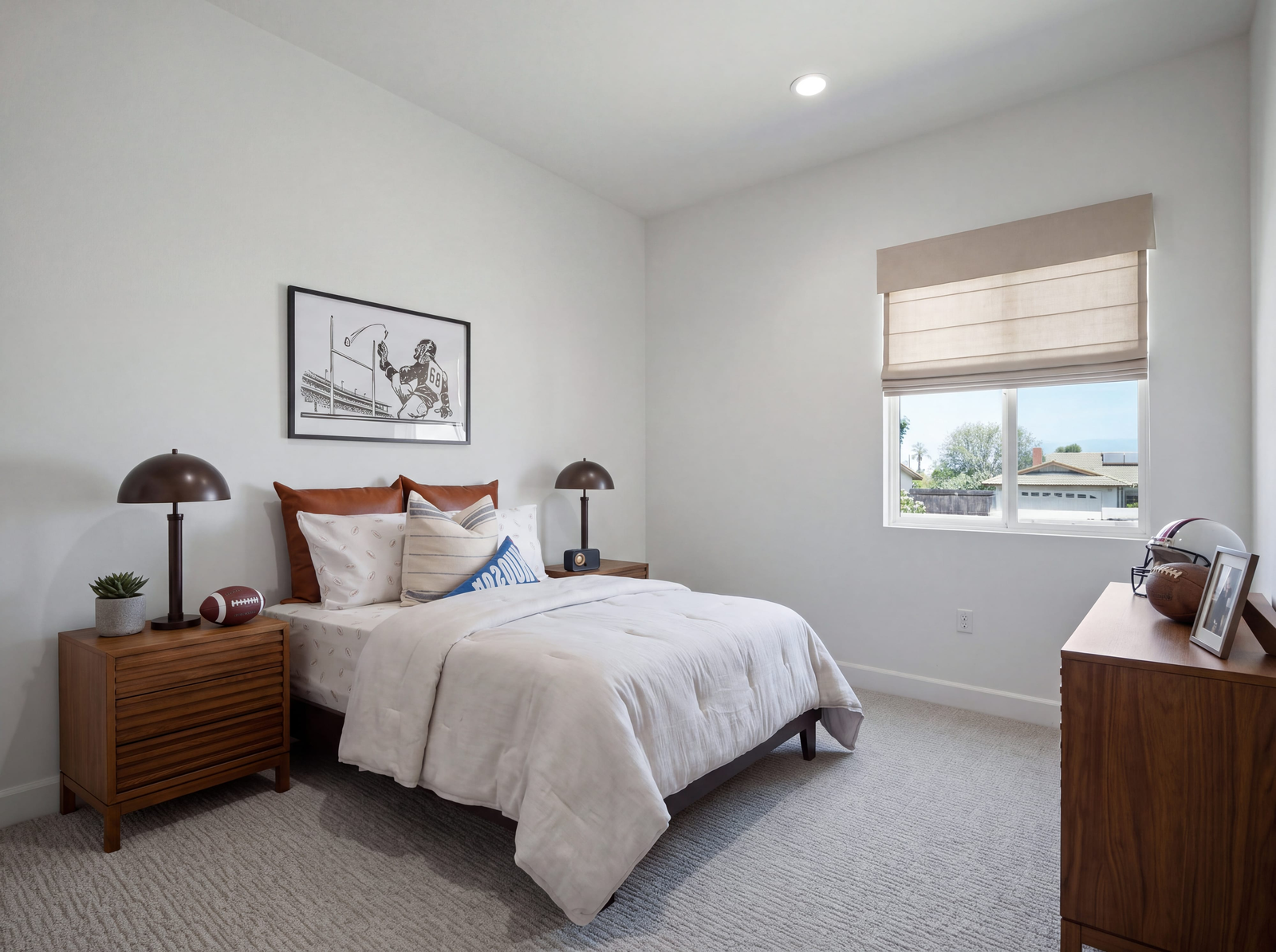 bedroom with neutral carpet floors and large windows