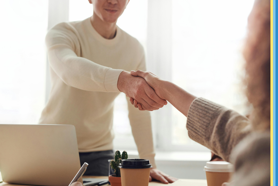 People shaking hands in a job interview.