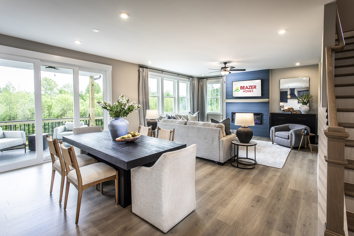 dining & great room with light flooring & windows