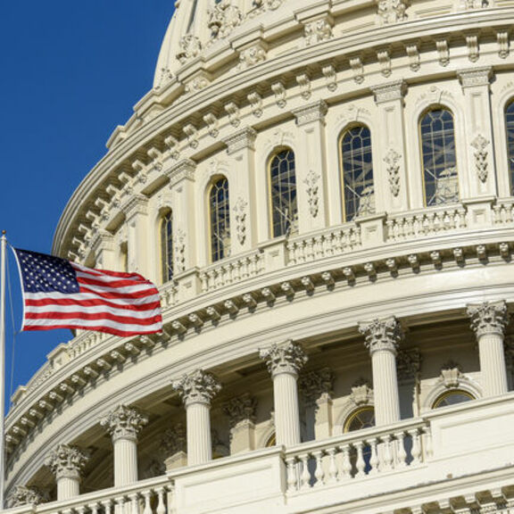 Washington capital building with American flag