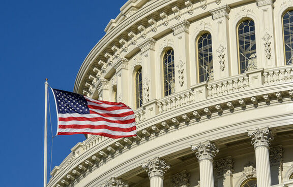 Washington capital building with American flag