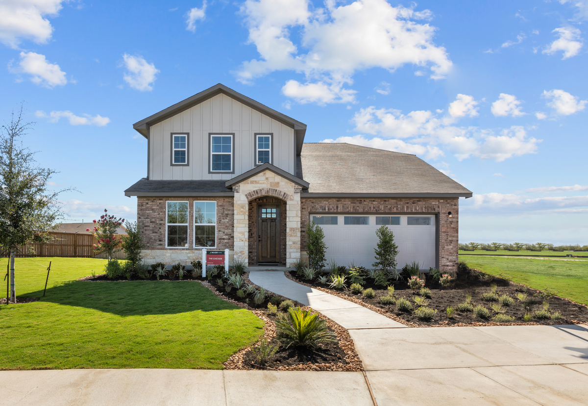 2-story home exterior with brick & stone 