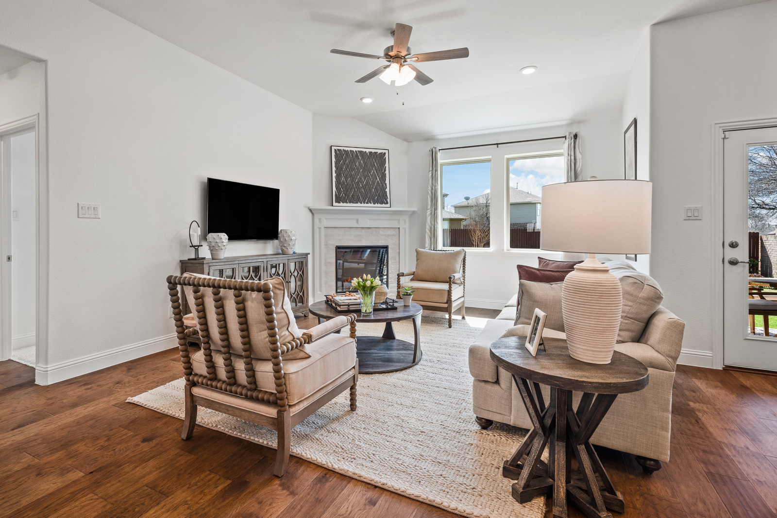 open-concept great room with electric fireplace