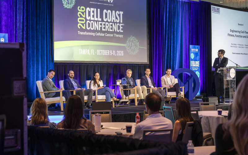 Photo of Dr. Fred Locke on stage at the podium at Cell Coast 2026