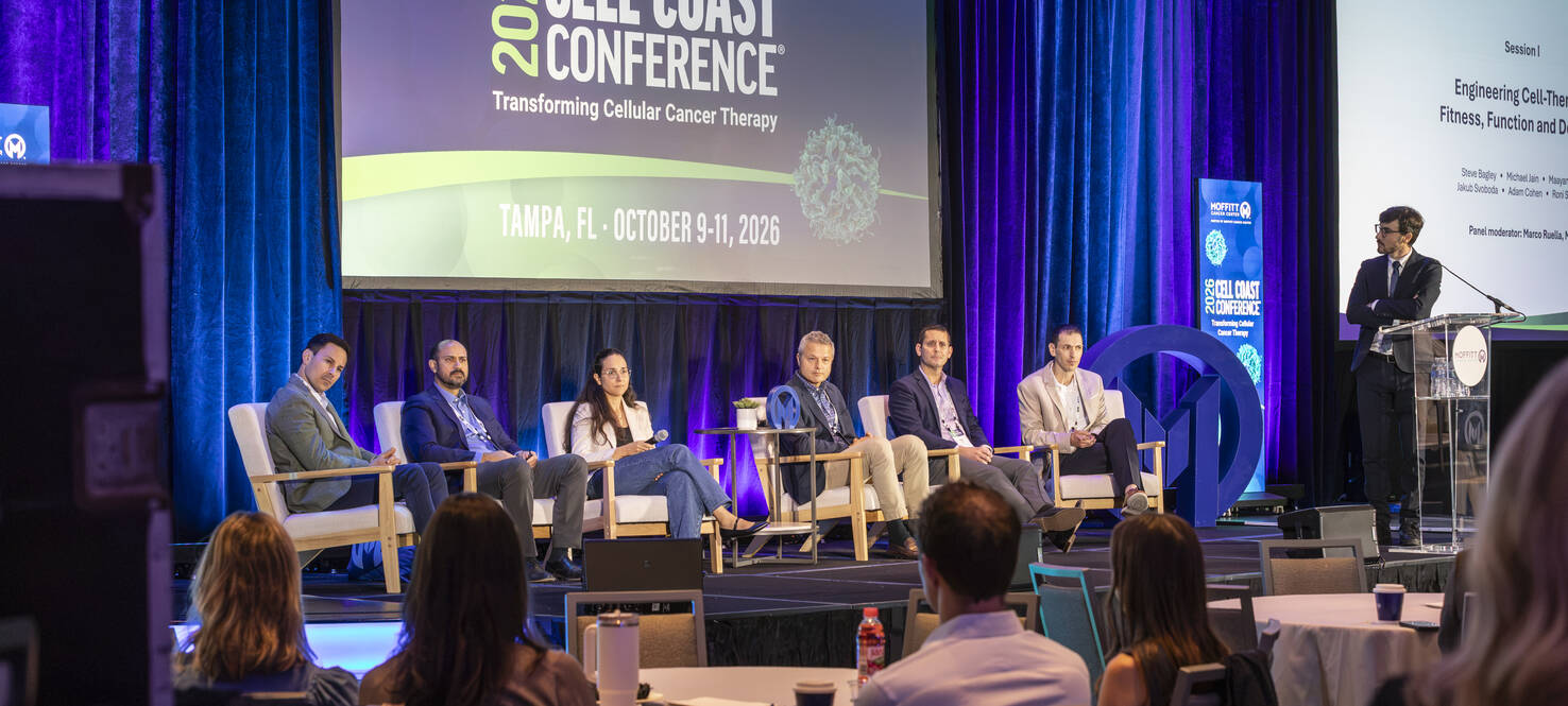 Photo of Dr. Fred Locke on stage at the podium at Cell Coast 2026