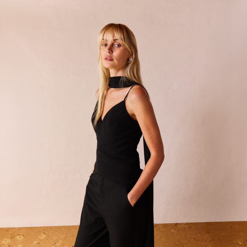 Woman in black top and pants
