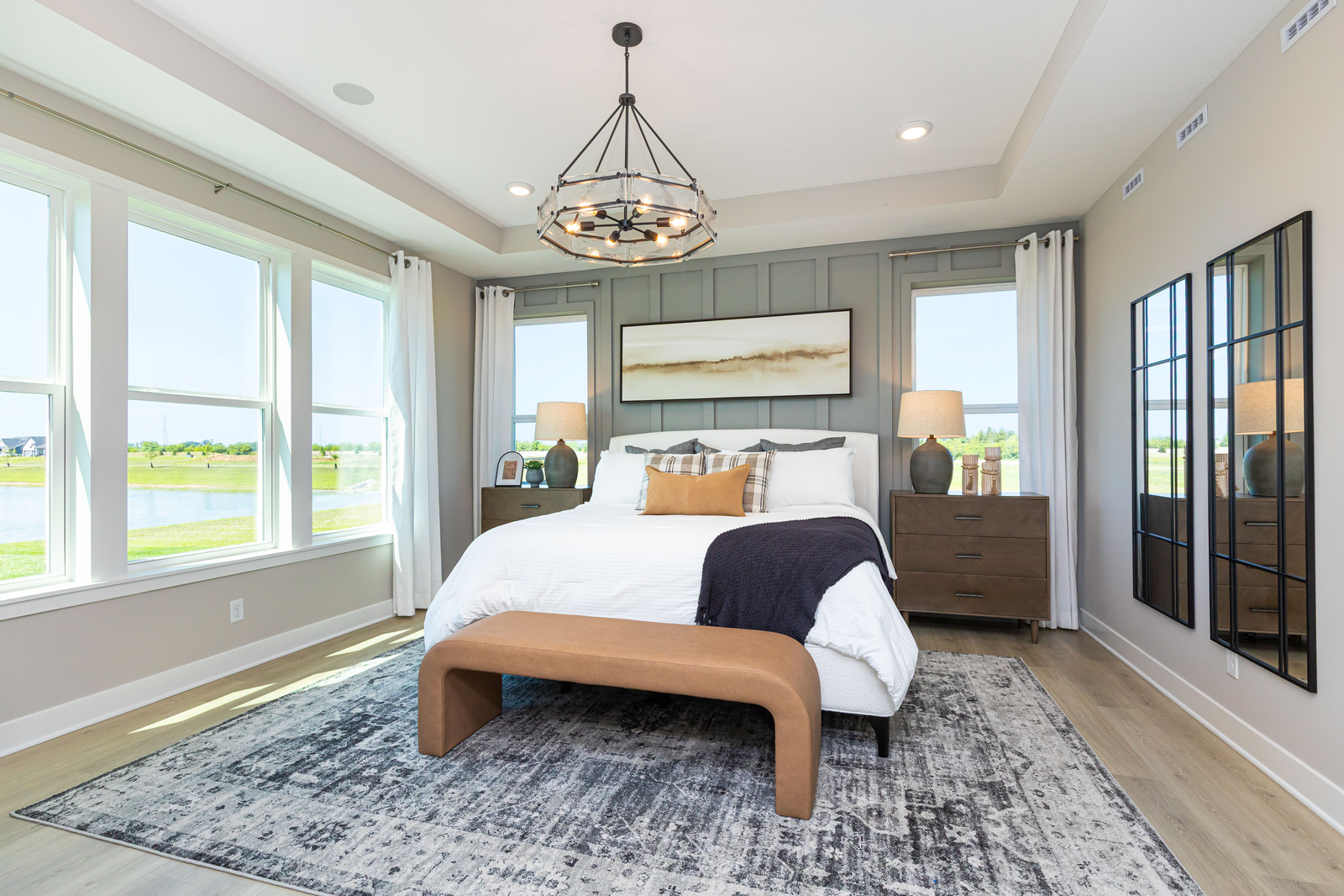 bedroom with gray accent wall behind bed