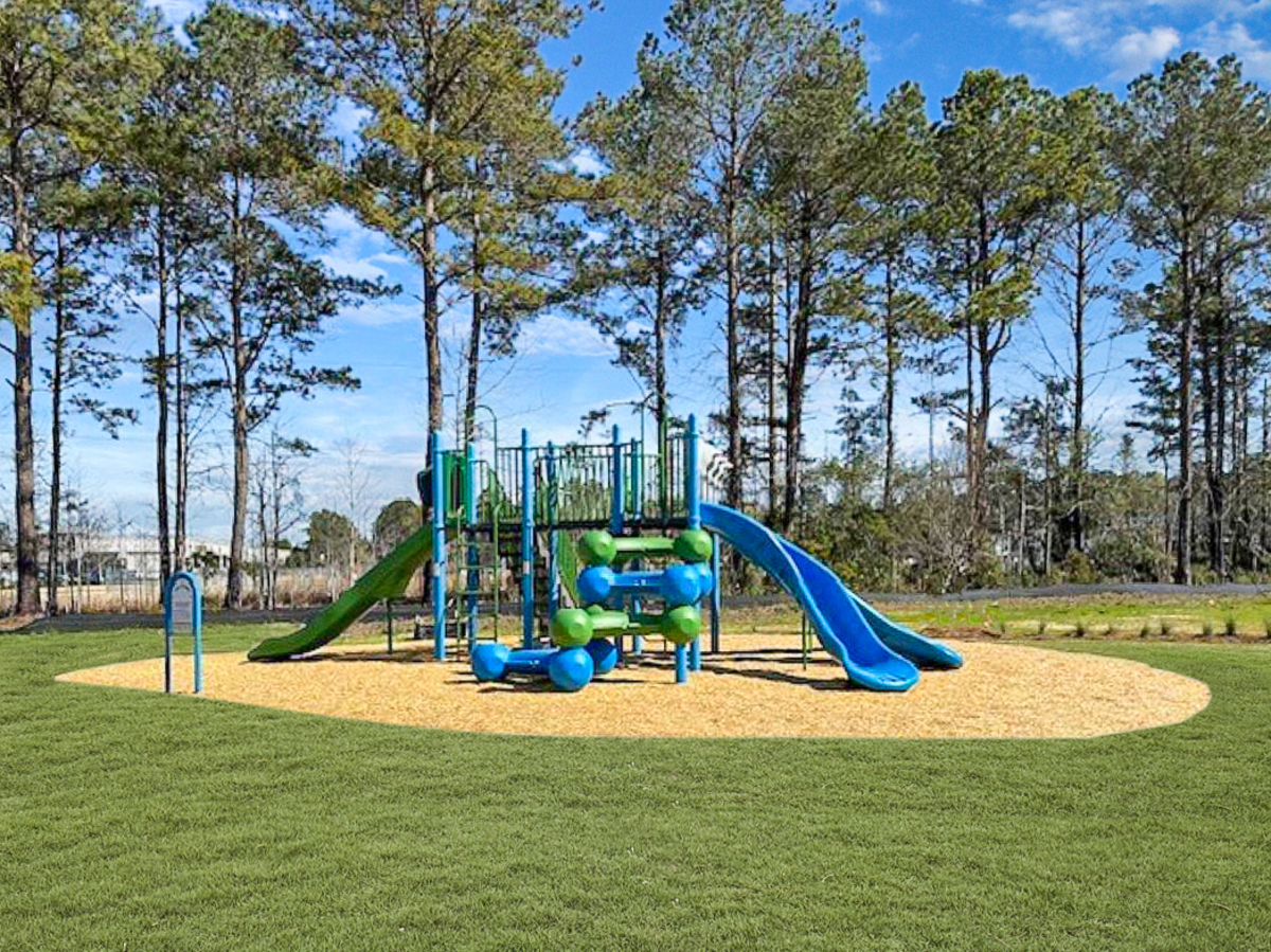 blue playground with green grass