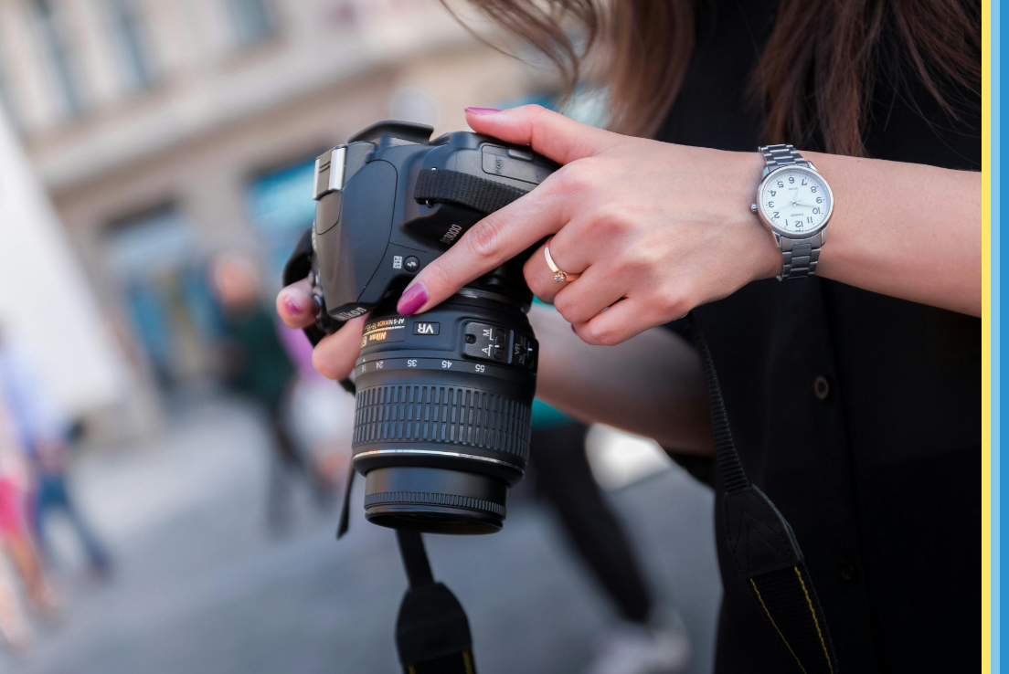 person holding digital camera