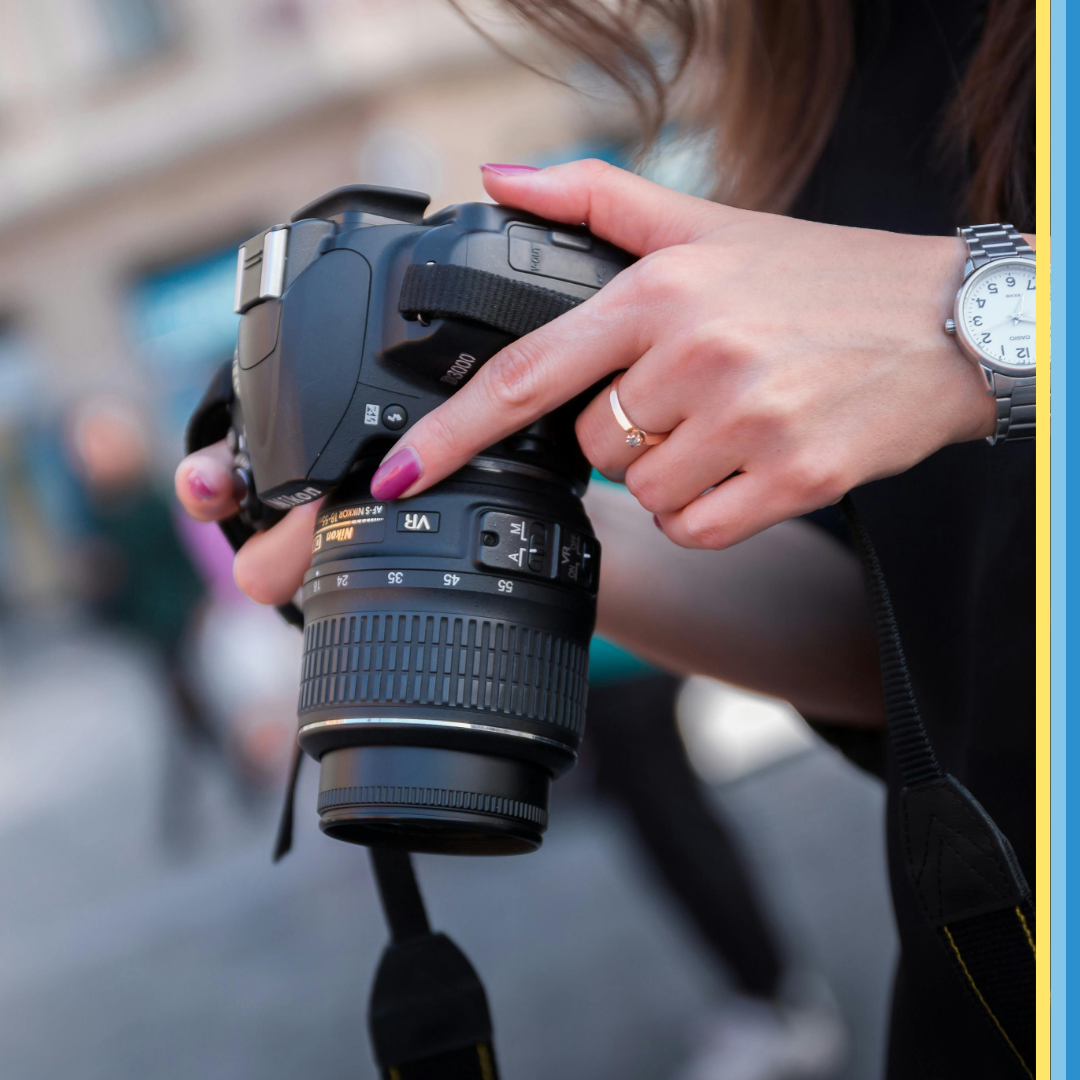 Perfecting your Professional Headshot - a person holding a digital camera